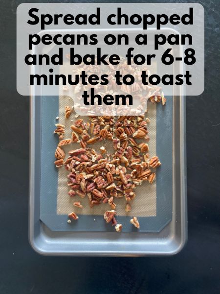 pecans on a baking sheet