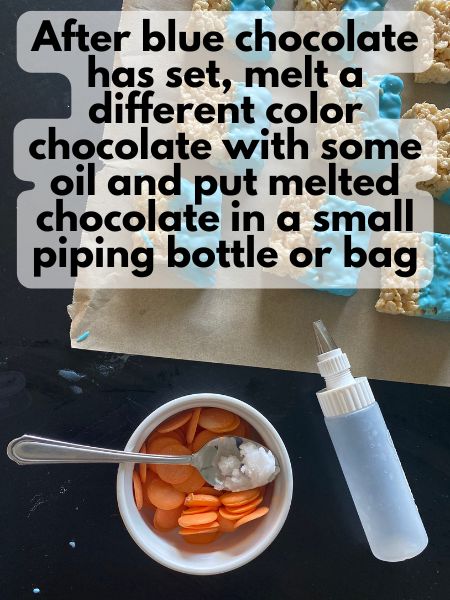 orange melting candies with some coconut oil, sitting next to an empty icing bottle with a wide, flat tip