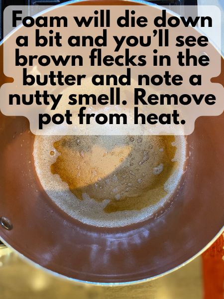 browned butter with brown flecks in a pan