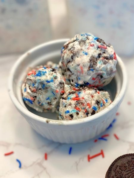 vanilla ice cream with red and blue sprinkles and chunks of Oreos