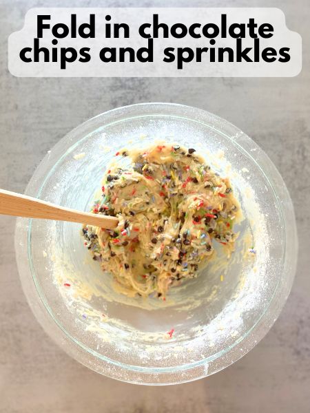 sprinkles and chocolate chips folded into cookie dough