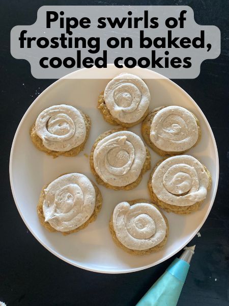 pumpkin sugar cookies with piped brown butter maple frosting