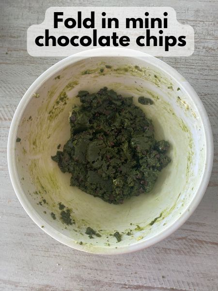mini chocolate chips folded into matcha cookie dough balls