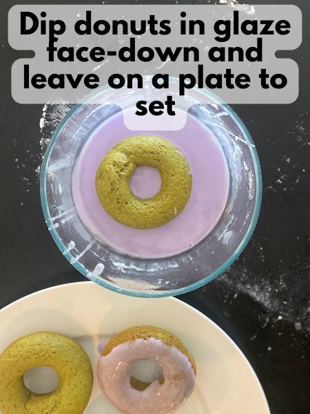 matcha donut sitting in lavender glaze