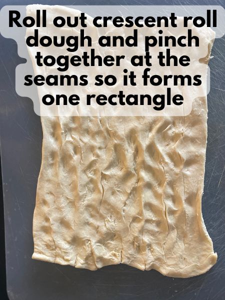 crescent roll dough pinched together into one rectangle