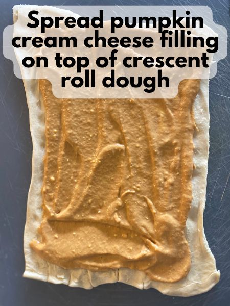 pumpkin cream cheese filling spread on crescent roll dough