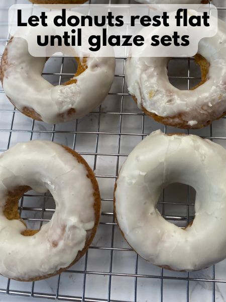 pumpkin donuts with maple glaze resting