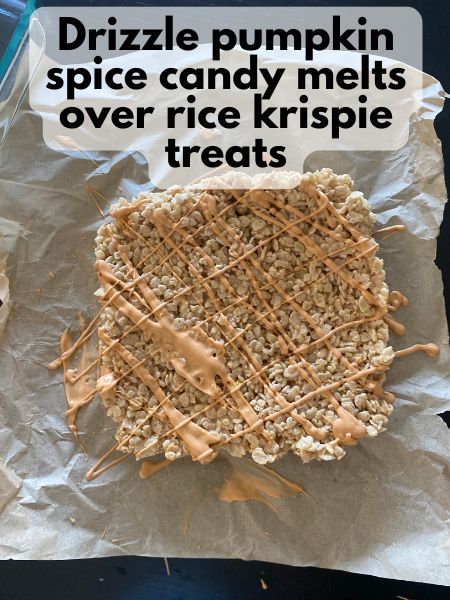 pumpkin spice candy melts drizzled over pumpkin spice rice krispie treats