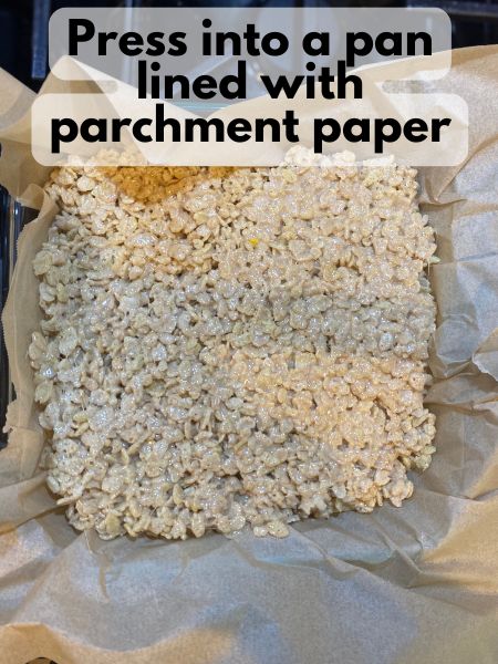 pumpkin spice rice krispie treats pressed into a pan