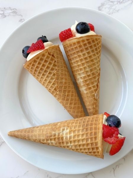 cheesecake cones with red and blue berries