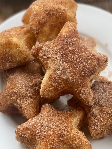 star-shaped churro bites coated in cinnamon sugar