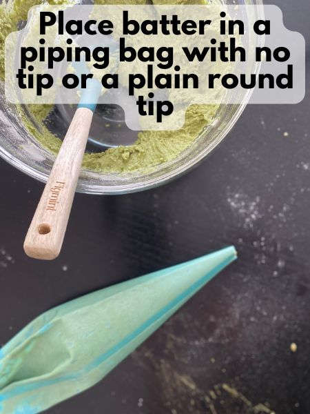 vegan matcha donut batter in a piping bag