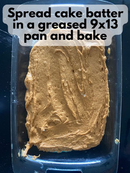 pumpkin spice cake batter spread in pan