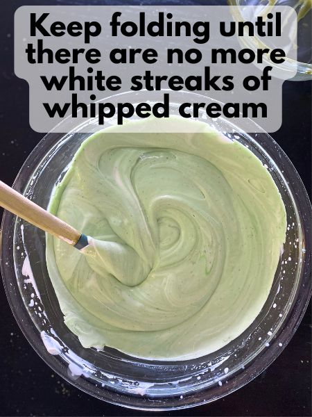 matcha mixture fully incorporated into whipped cream