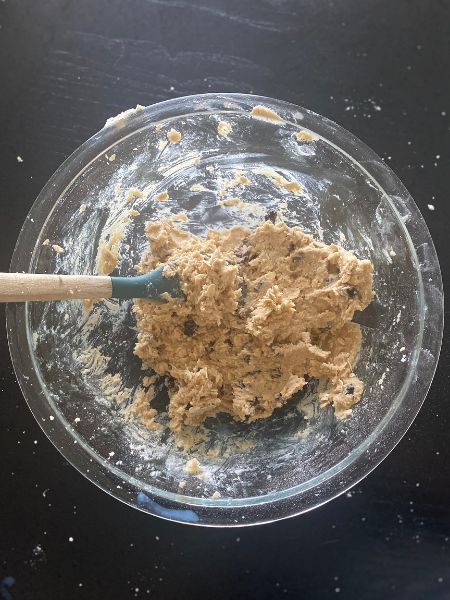 raisins and oats folded into oatmeal raisin cookie dough