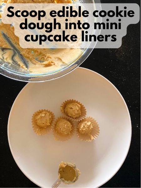 pumpkin edible cookie dough scooped into mini cupcake liners