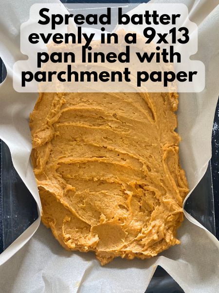 pumpkin blondie batter spread in a 9x13 pan