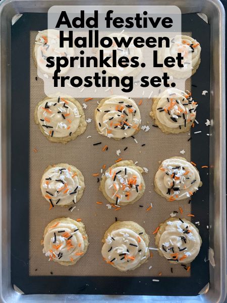 baked cookies with buttercream frosting and sprinkles