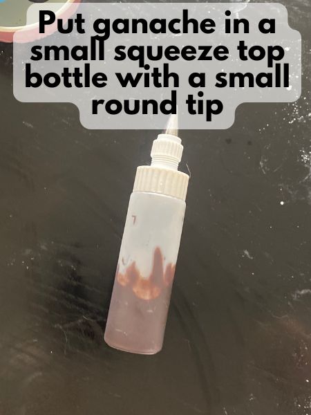 chocolate ganache in a squeeze top bottle with a small tip