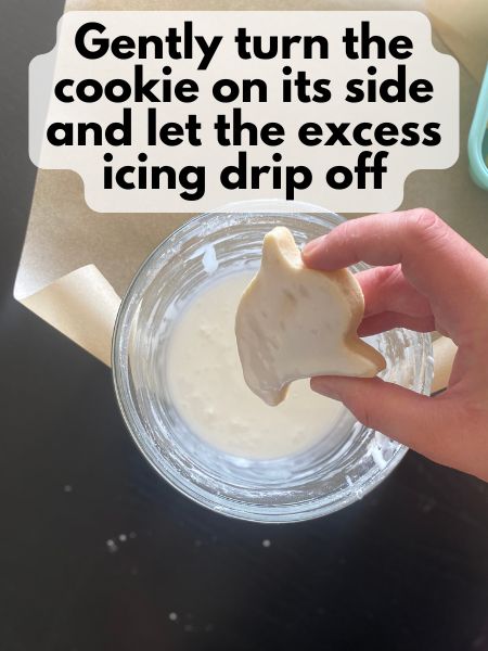 royal icing dripping off of Halloween ghost sugar cookies