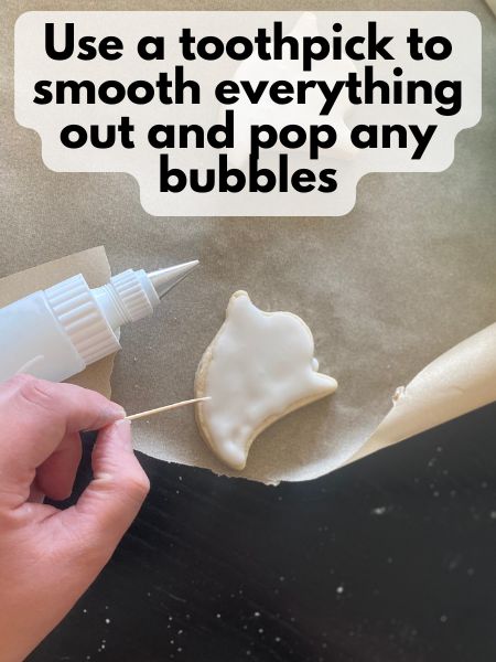 pupping bubbles in royal icing with a toothpick