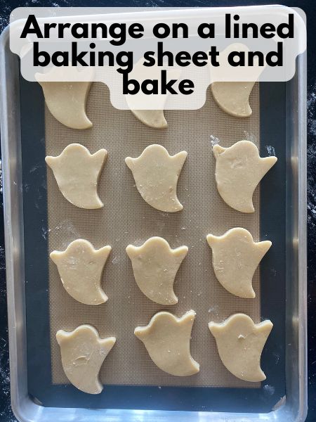 ghost sugar cookies on baking sheet