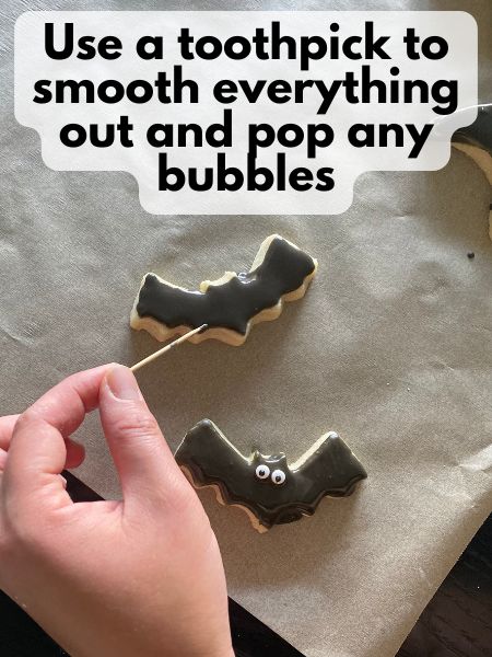 spreading royal icing and popping bubbles