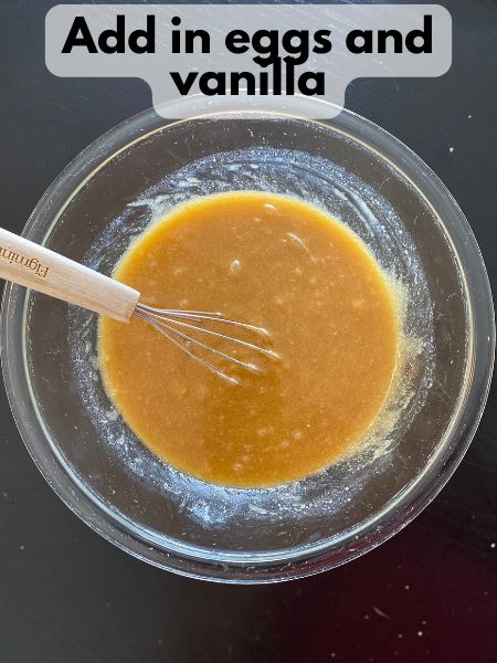 melted butter and sugar mixed with eggs and vanilla