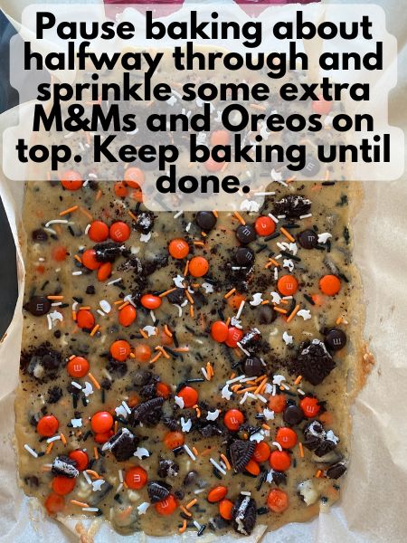 extra M&M's, sprinkles and Oreos sprinkled on top of par-baked Halloween blondies