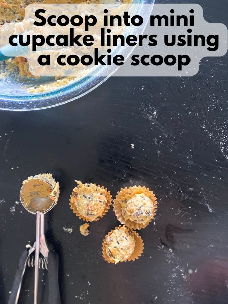 Halloween cookie dough balls scooped into mini cupcake liners