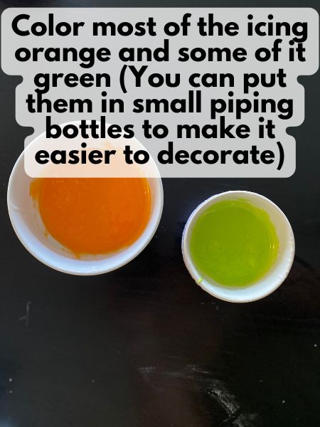 royal icing in two bowls: one orange and one green