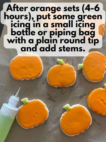 stems piped onto decorated pumpkin cookies