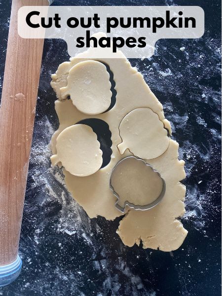 pumpkin shapes cut out of dough