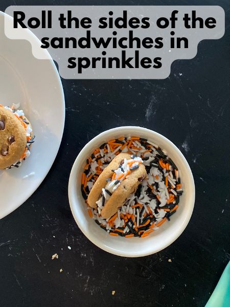 sandwich cookies being rolled in sprinkles