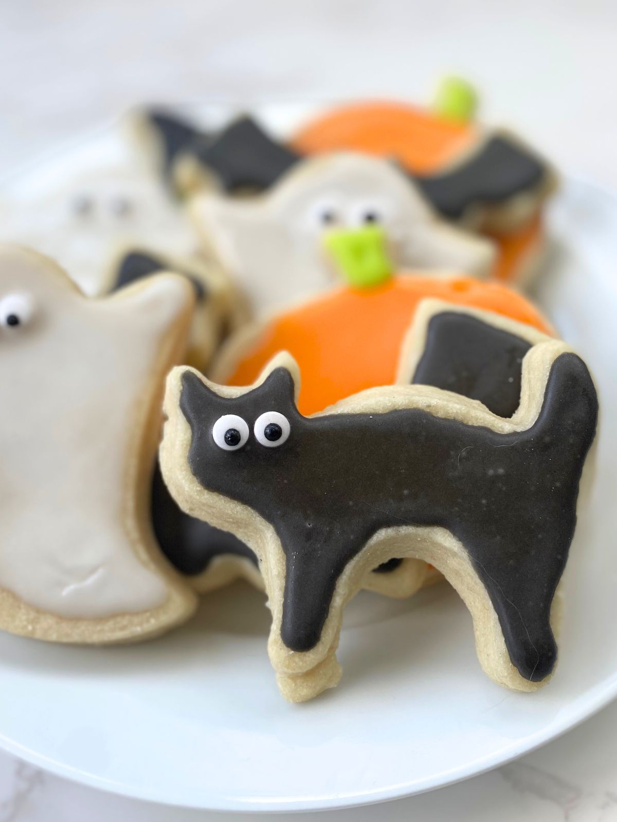 halloween decorated sugar cookies on a plate