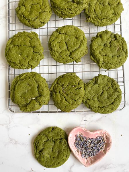 matcha cookies with lavender on a wire rack