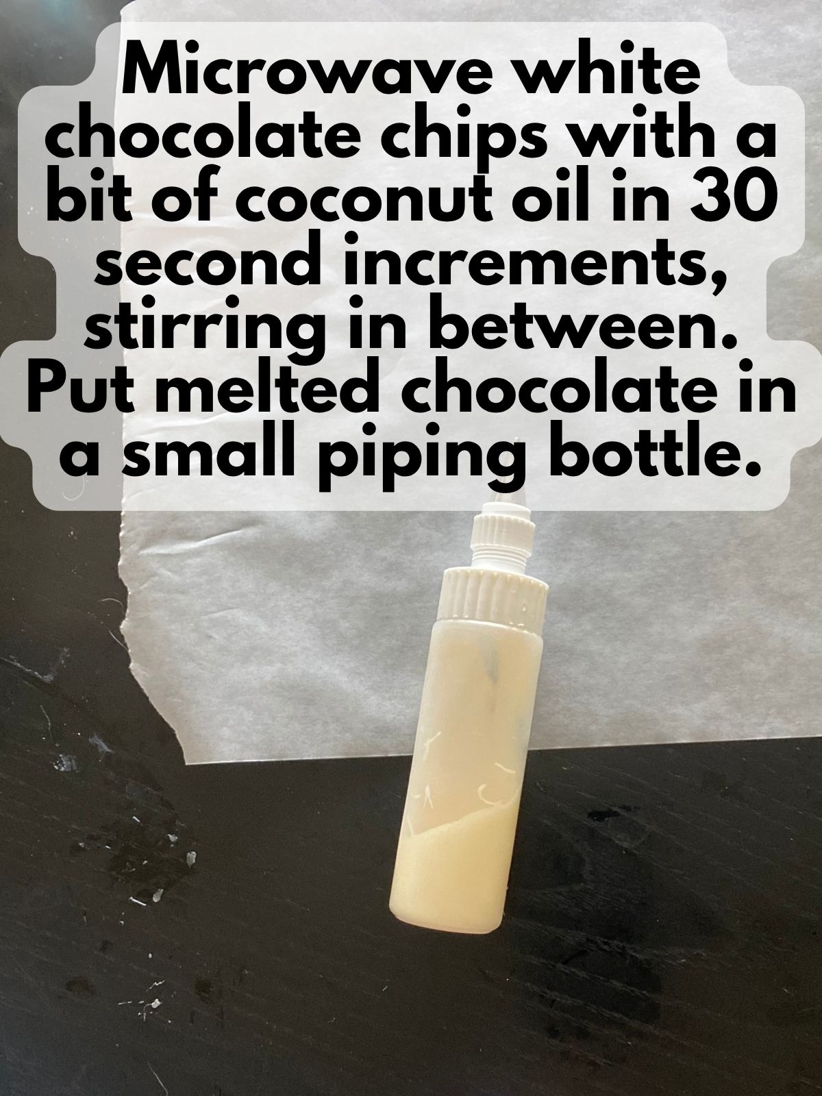 melted white chocolate in a small icing bottle