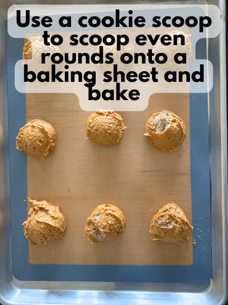 pumpkin whoopie pie batter scooped on baking sheet