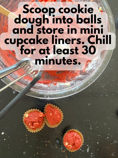 red velvet cookie dough scooped into mini cupcake lineres