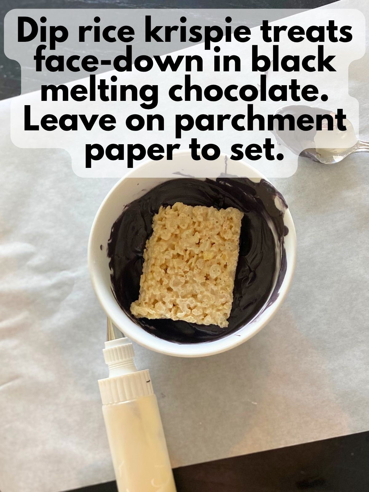 rice krispie treat dipped in black candy melts