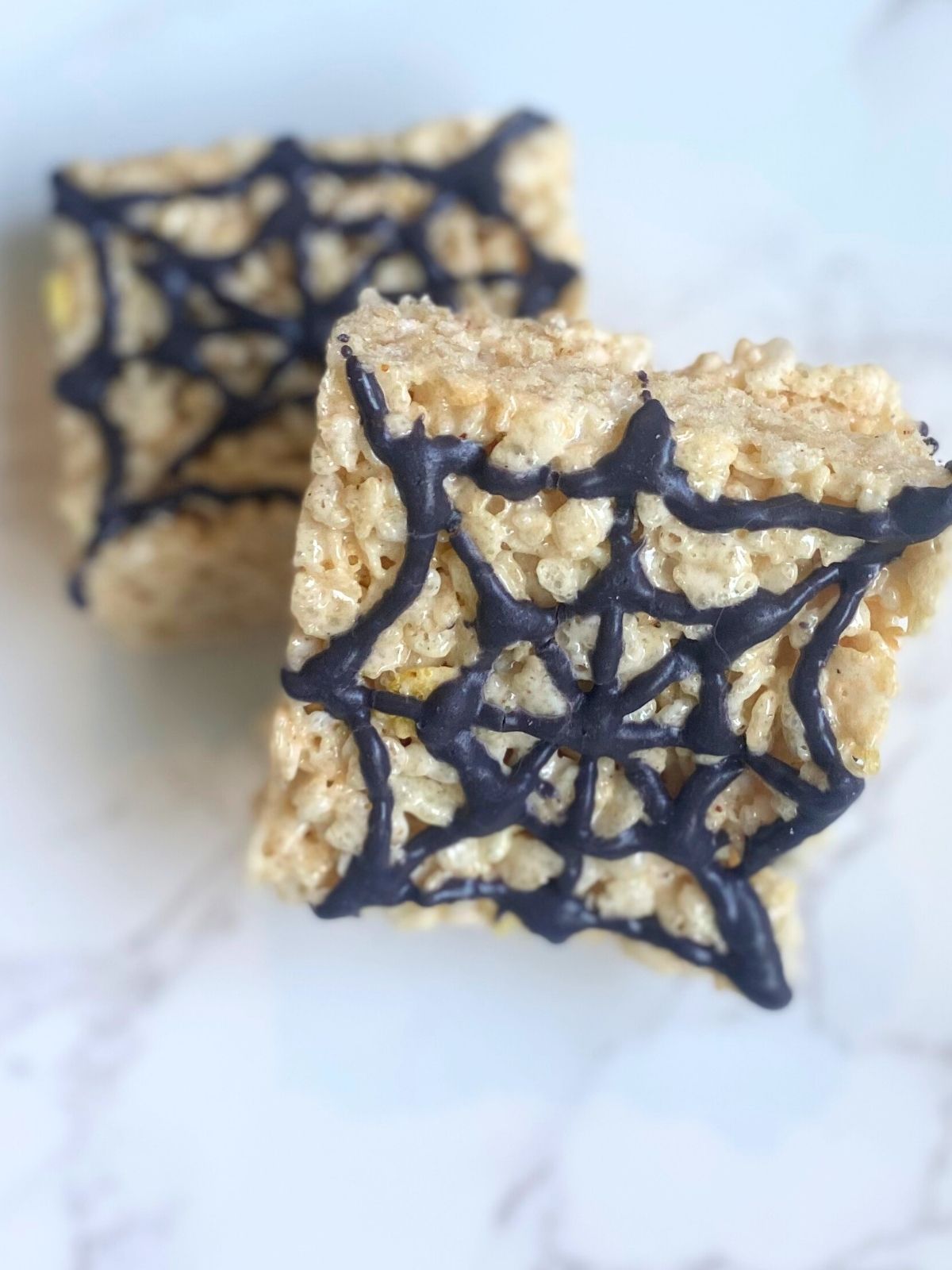spider webs piped directly onto rice krspie treats