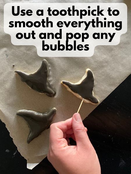 pop bubbles in icing with toothpick