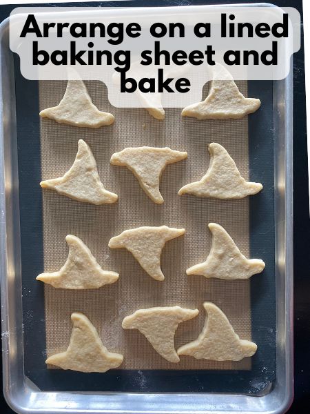 hat-shaped cookies on baking sheet