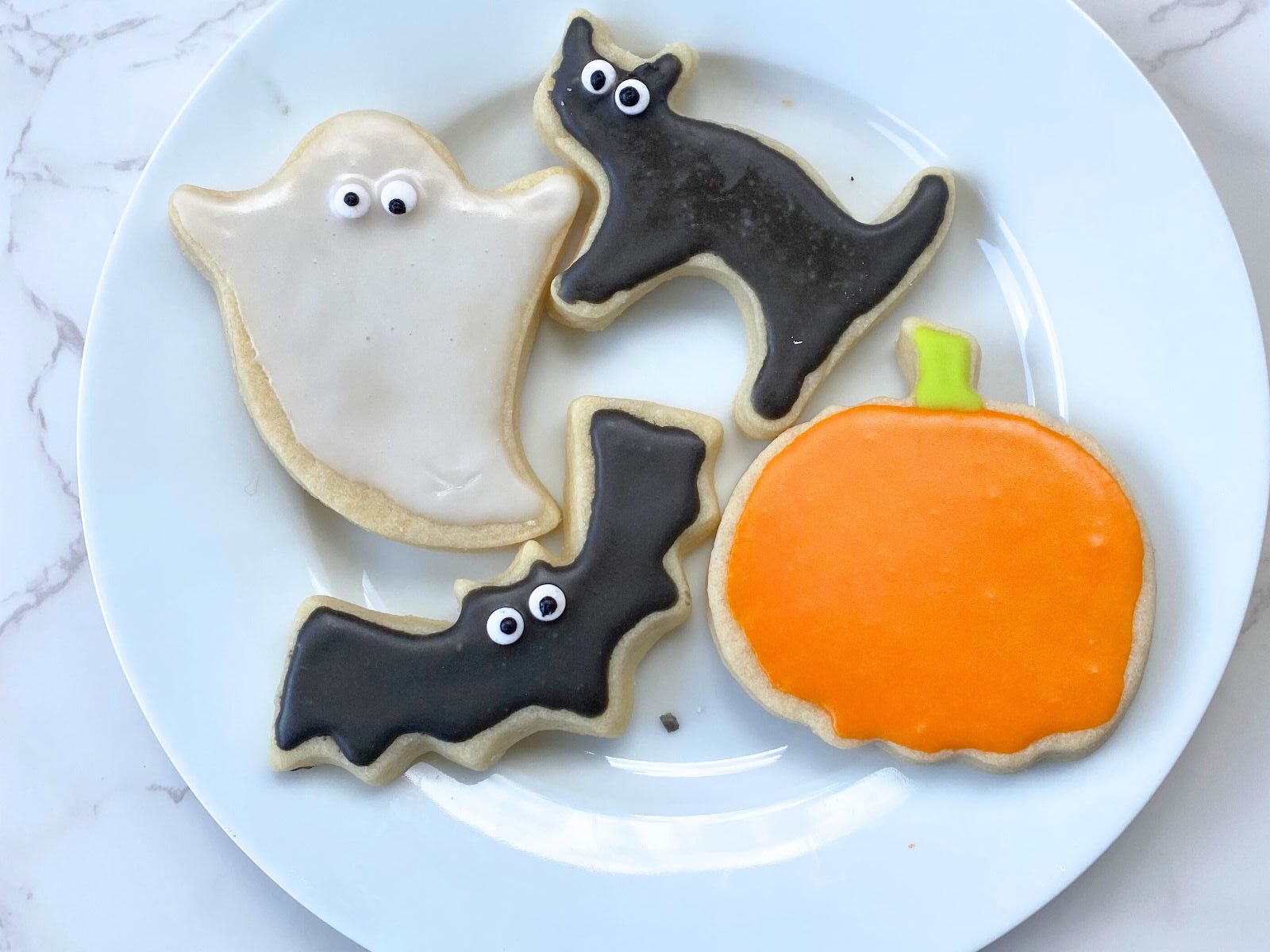 decorated Halloween cookies on a plate