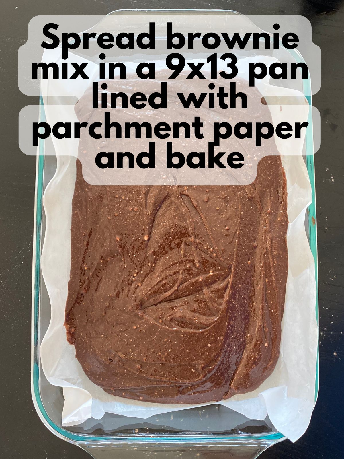 brownie batter spread in a 9x13 pan