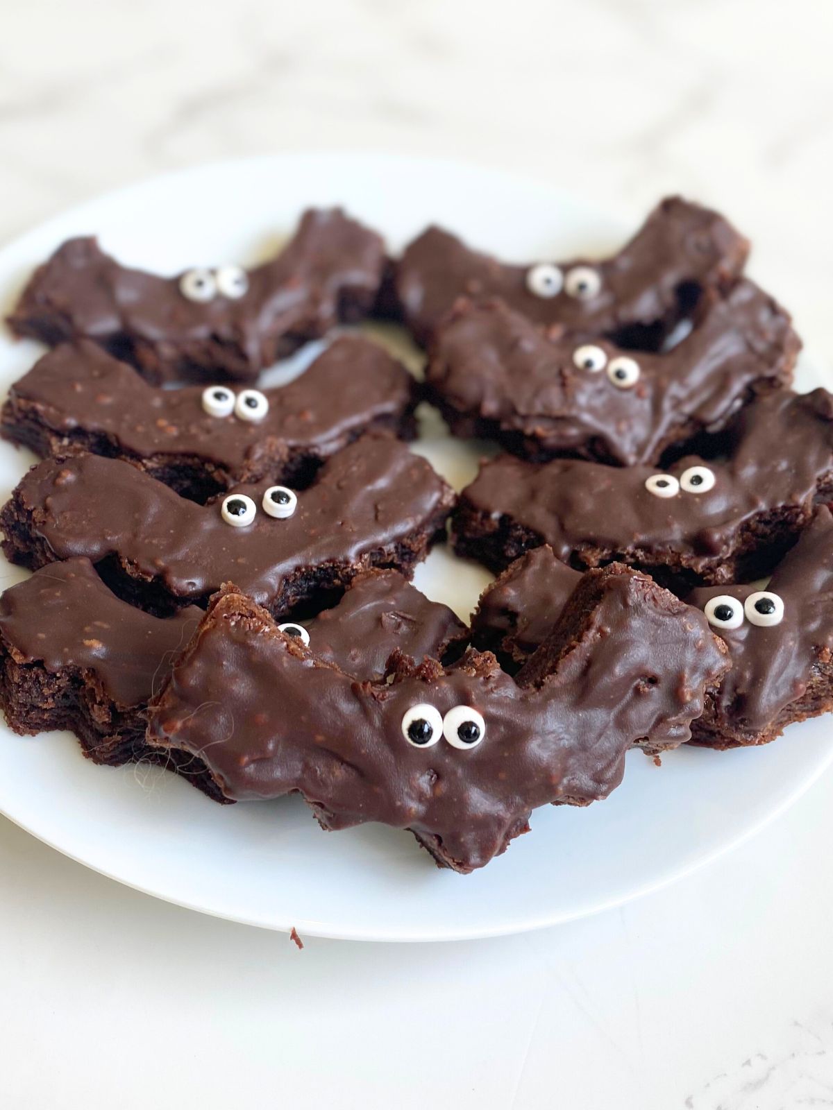 decorated bat brownies on a plate