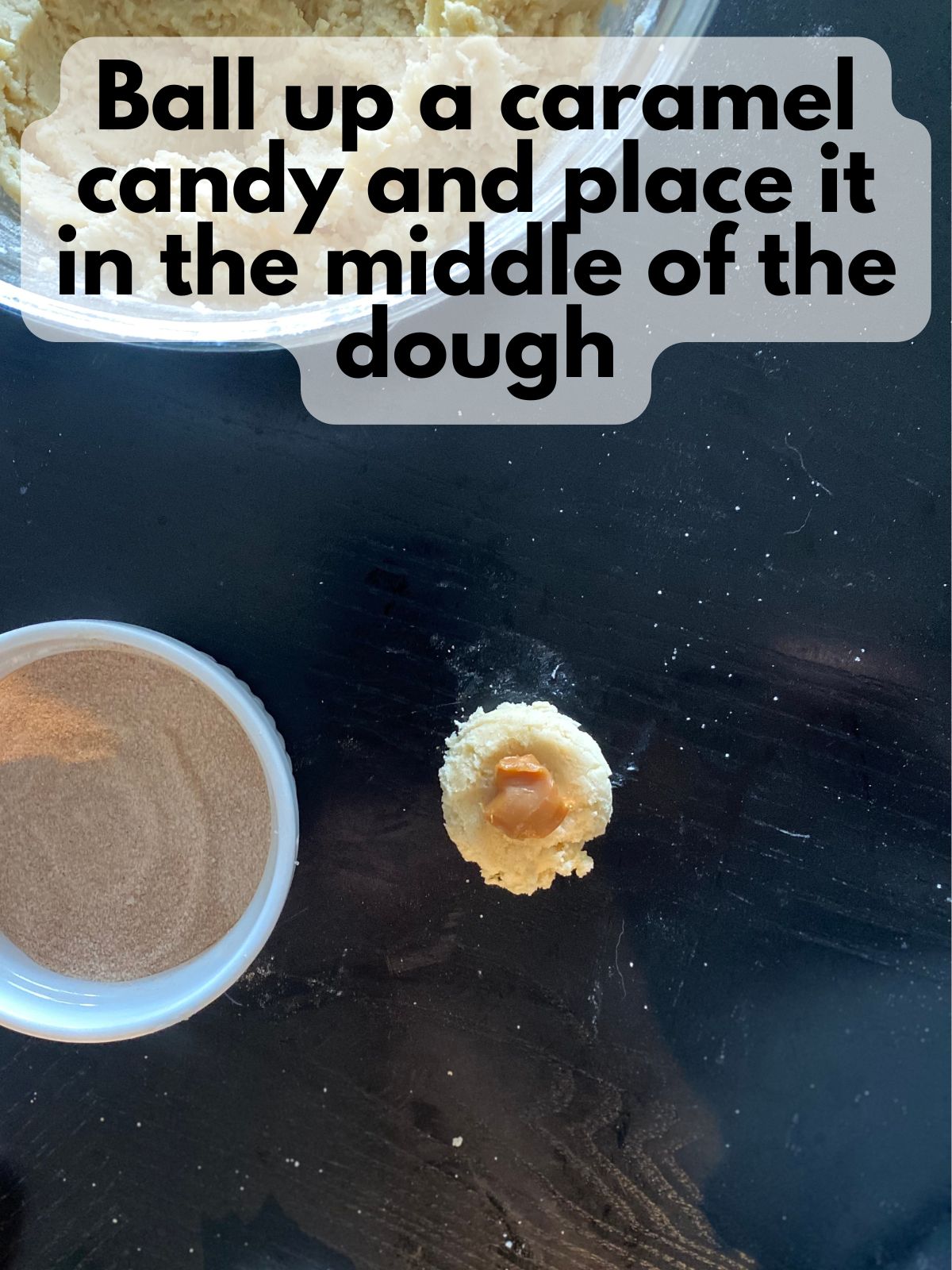 caramel candy in the middle of snickerdoodle dough disc