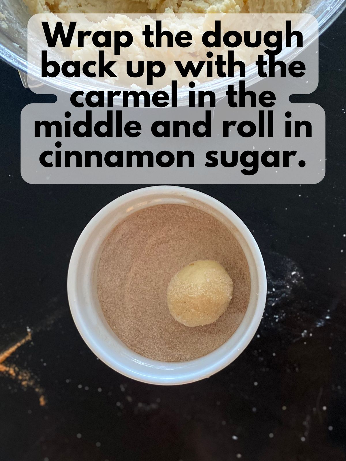 snickerdoodle dough ball rolled in cinnamon sugar