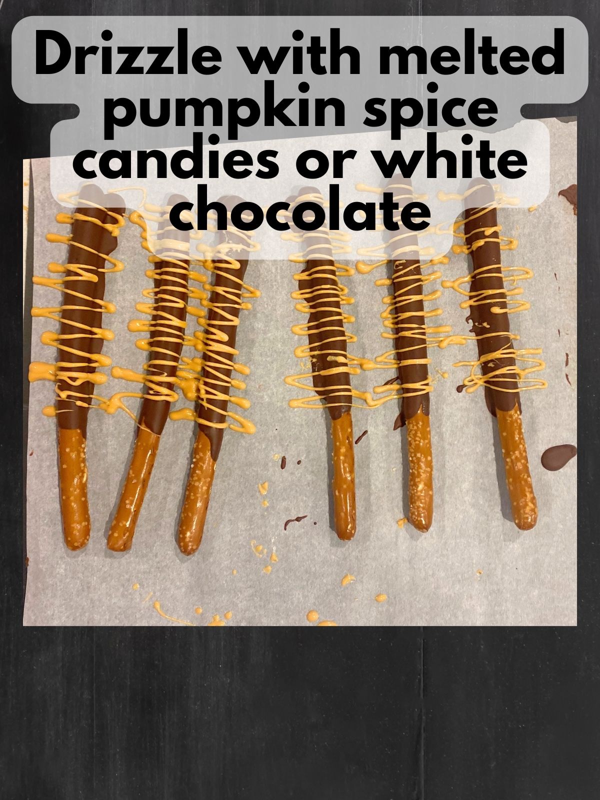 chocolate coated pretzel rods with pumpkin spice drizzle