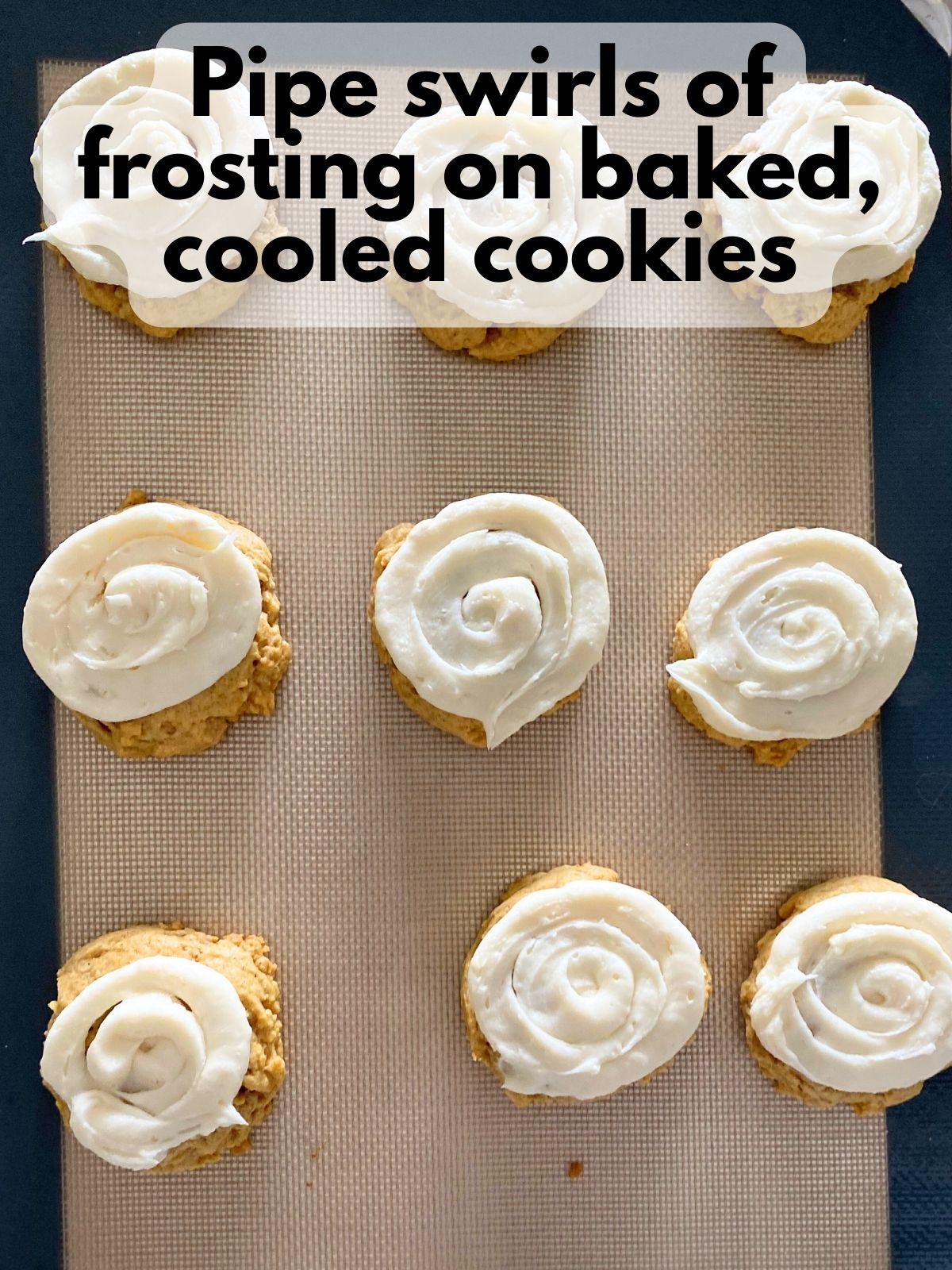 cream cheese frosting piped on top of pumpkin sugar cookies